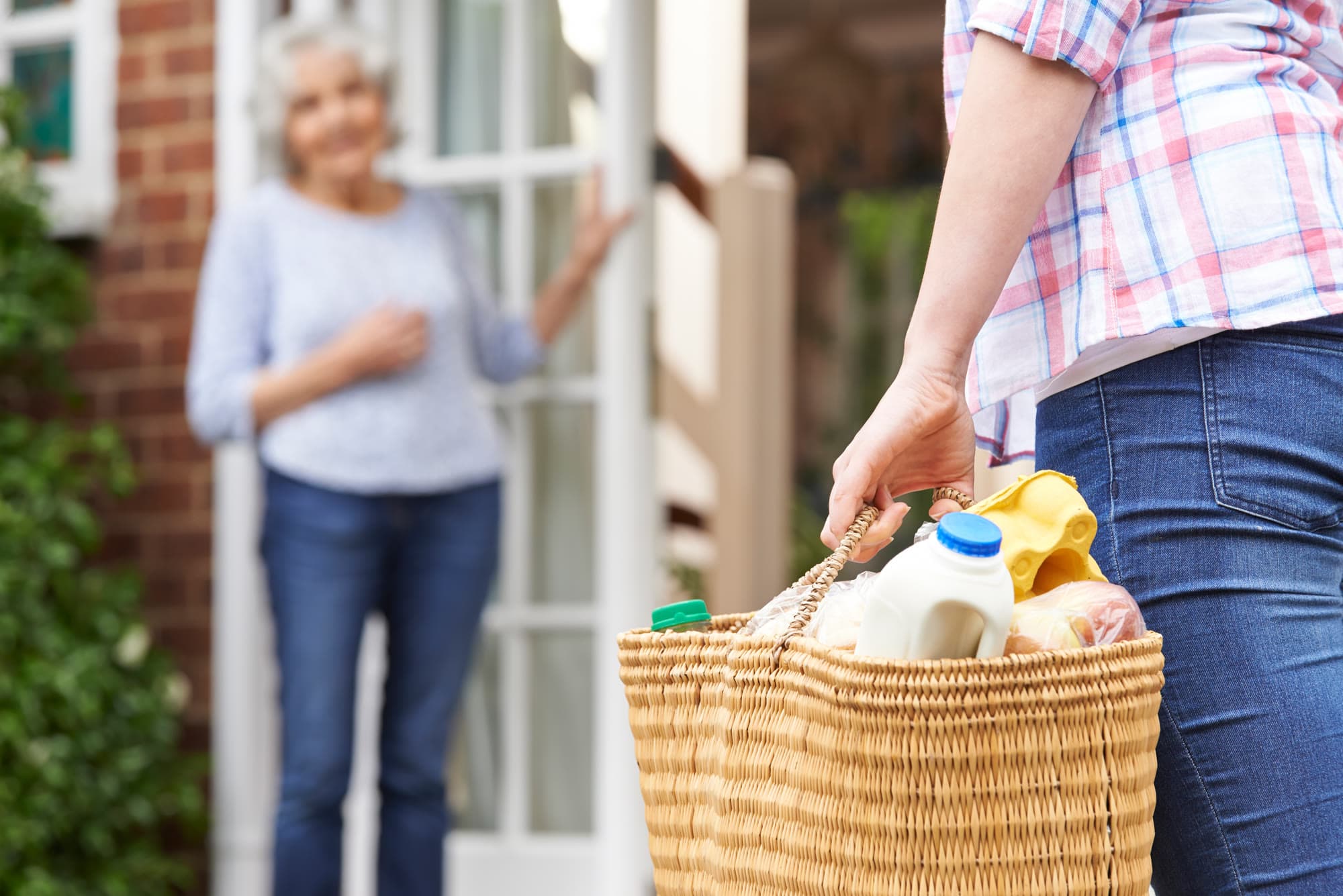 Groceries being delivered with a warm greeting